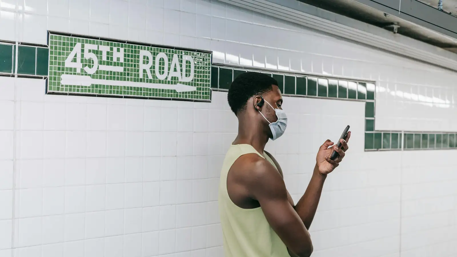 Man practicing languages on his phone in the city