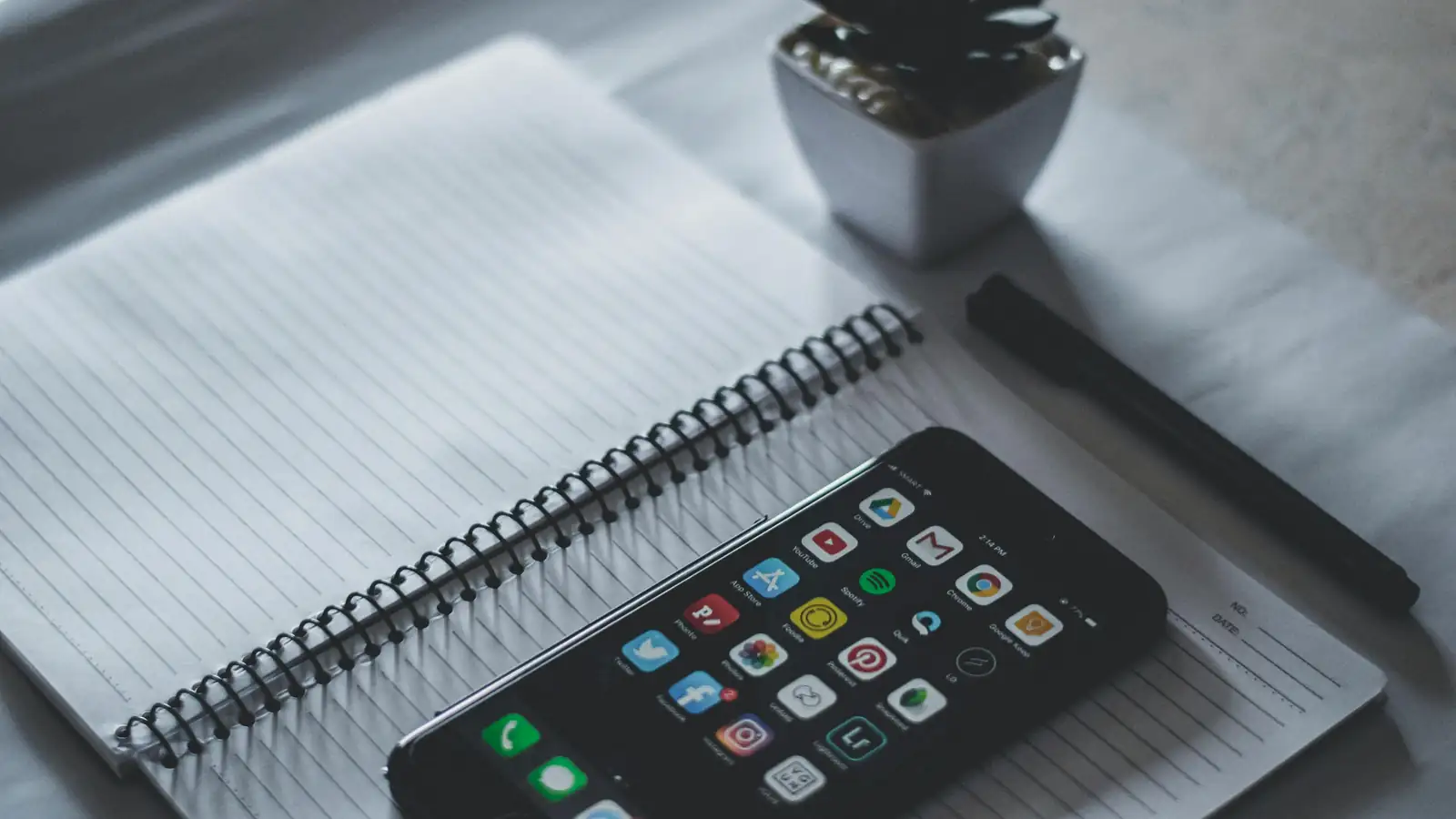 Desk with language learning materials and smartphone