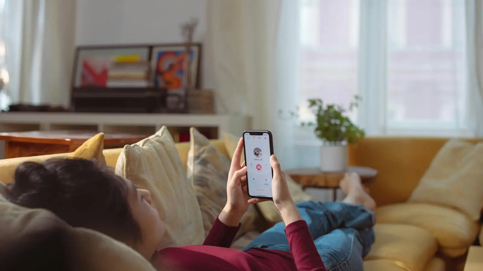 Woman using language learning app on her phone at home