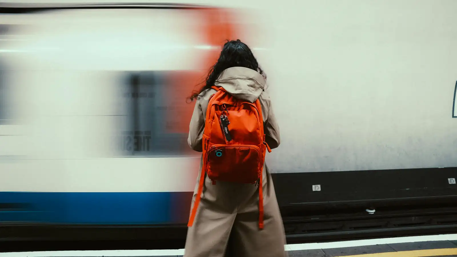 Student reviewing vocabulary on smartphone while commuting