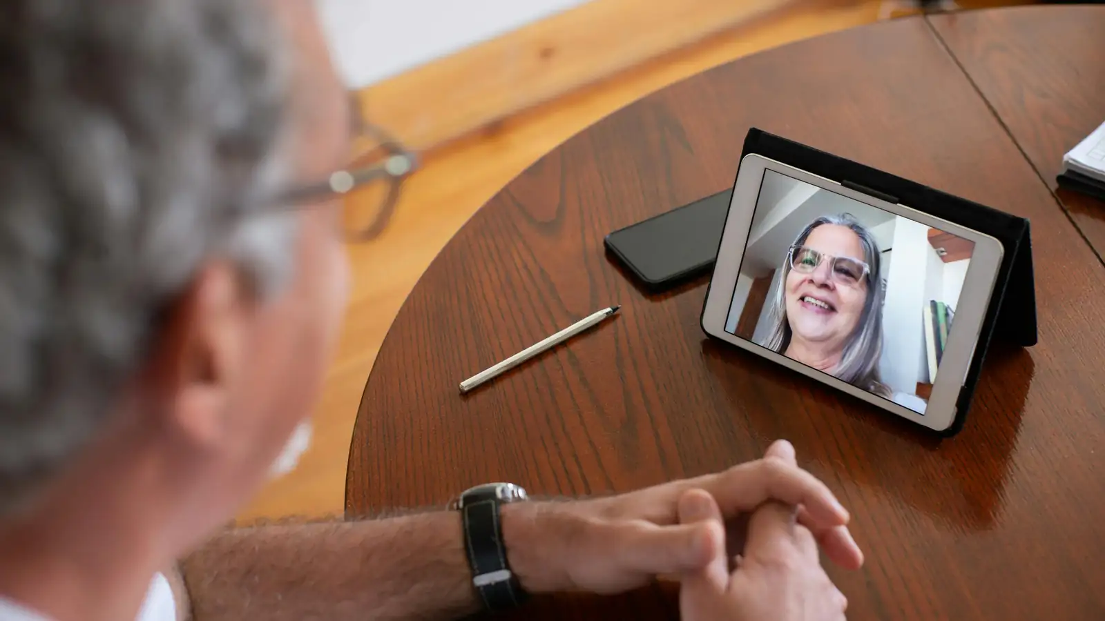 Woman studying a language on her tablet at home